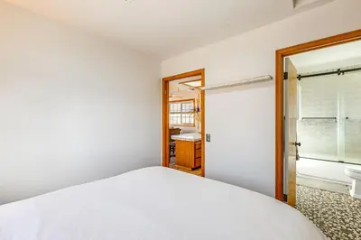 a bedroom with a white bed and a bathroom at Mtn-View Weldon Home Walk to Pacific Crest Trail in Weldon