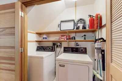 a small kitchen with a washer and dryer at Northstar Retreat in Kingswood Estates