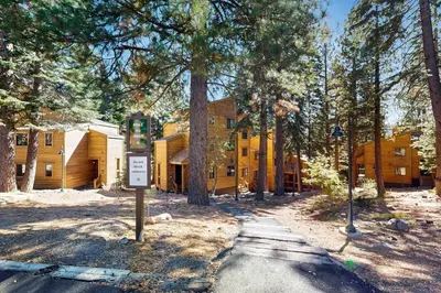a yellow building with a sign in front of it at Northstar Retreat in Kingswood Estates