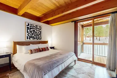 a bedroom with a bed and a large window at Northstar Retreat in Kingswood Estates