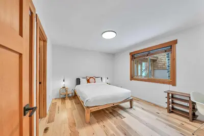 a white bedroom with a bed and a window at Stunning Mountain Gem with Hot Tub Near Palisades in Olympic Valley