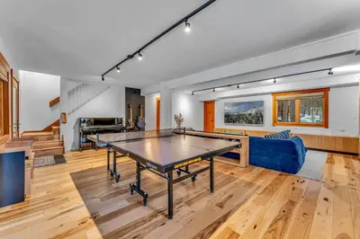 a living room with a ping pong table in it at Stunning Mountain Gem with Hot Tub Near Palisades in Olympic Valley