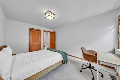 a bedroom with a bed and a desk and a chair at Pet-Friendly Home, Deck, 1 Mile to Alpine Meadows in Alpine Meadows