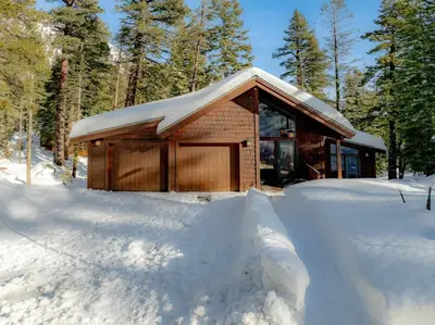 a log cabin in the snow with snow around it at Pet-Friendly Home, Deck, 1 Mile to Alpine Meadows in Alpine Meadows