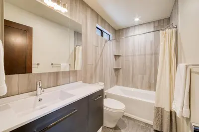 a bathroom with a sink and a toilet and a tub at Valley View Townhome # 10 at Palisades by Tahoe Getaways - Shuttle & Walk to the Village! in Olympic Valley