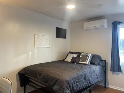 a bedroom with a bed in a room at A Little Bit Of Country in Visalia