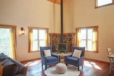 a living room with a couch and chairs and a fireplace at Rare Deluxe Family Cabin - Yosemite & Bass Lake in Bass Lake Annex