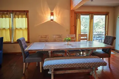 a dining room with a wooden table and chairs at Rare Deluxe Family Cabin - Yosemite & Bass Lake in Bass Lake Annex