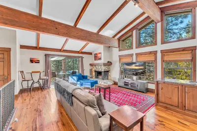a living room with a couch and a fish tank at 3-Level Incline Village Retreat with Fireplace in Incline Village