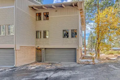 a house with two garage doors in front of it at 3-Level Incline Village Retreat with Fireplace in Incline Village