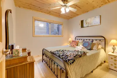 a bedroom with a bed and a ceiling fan at 5 Mi to Dodge Ridge Cabin in Strawberry in Strawberry