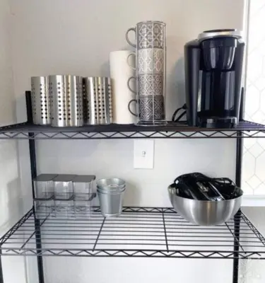 a shelf with books and other items on it at Nifty Trailer With Spacious Parking in Visalia