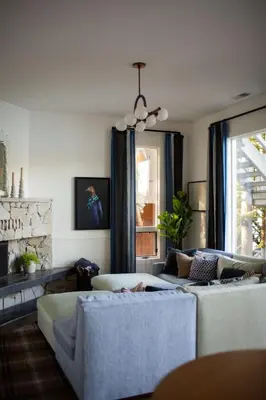 a living room with two beds and a couch at Luxury Lakefront 5 Br Home Hot Tub Arcade in Truckee