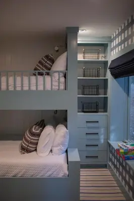 a bedroom with two bunk beds and a window at Luxury Lakefront 5 Br Home Hot Tub Arcade in Truckee