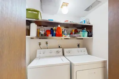 a laundry room with a washer and dryer at Wolf Tree Wonder in Truckee