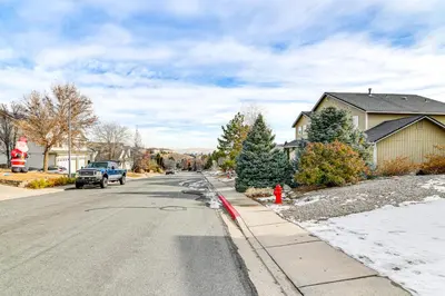 a red fire hydrant on the side of a street at Family Reno Home with Game Room! 28 Mi to Ski Resort in Reno