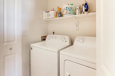 a laundry room with a washer and dryer at 4 Mi to Dtwn Family-Friendly Townhome in Reno in Reno