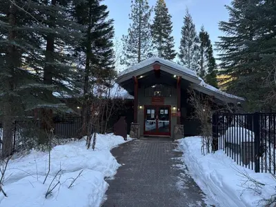 a building with a snow covered walkway in front of it at Timber Creek 309 condo in Truckee