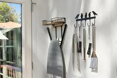 a bunch of knives hanging on a wall at Cozy Reno Midtown Retreat Fire Pit & Parking in Reno