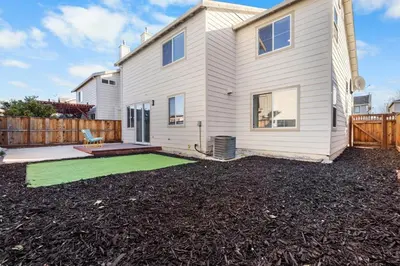 a house with a green lawn in front of it at 4 bedroom Home in Tracy 2 Minutes to Highway in Tracy
