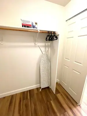 a room with a white door and a wooden floor at 4 bedroom Home in Tracy 2 Minutes to Highway in Tracy