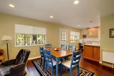 a kitchen and dining room with a table and chairs at Ormsby House 1489O in South Lake Tahoe