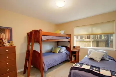 a bedroom with two beds and a bunk bed at Ormsby House 1489O in South Lake Tahoe
