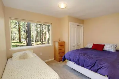 a bedroom with a bed and a window at Ormsby House 1489O in South Lake Tahoe
