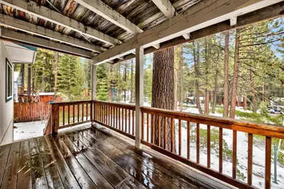 a screened porch with a view of the woods at Kamp Koyukon 1939K in South Lake Tahoe
