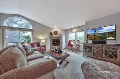 a living room with a couch and a tv at 2272L The Lupine Lodge in South Lake Tahoe