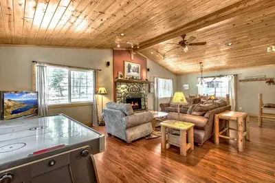a living room with a couch and a fireplace at 1965NP The Bears Den in South Lake Tahoe