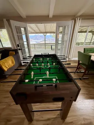a living room with a pool table with green cloth at Scenic Lake House & Dog Friendly in Wofford Heights
