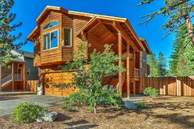 a wooden house with a tree at Das Waldhaus 1973P in South Lake Tahoe