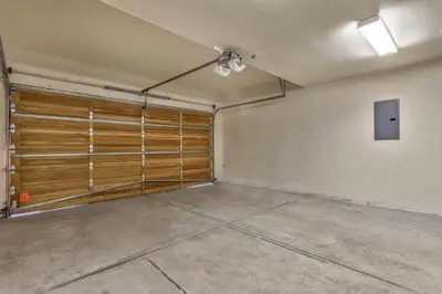 an empty garage with wooden doors and a ceiling at Das Waldhaus 1973P in South Lake Tahoe