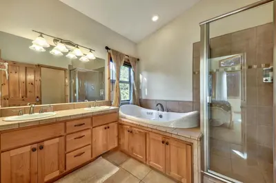 a bathroom with two sinks and a tub and a shower at Das Waldhaus 1973P in South Lake Tahoe