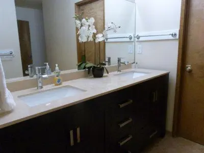 a bathroom with two sinks and a large mirror at 121M The Meadow Drive in Stateline