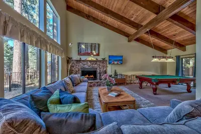 a living room with a couch and a pool table at 121M The Meadow Drive in Stateline