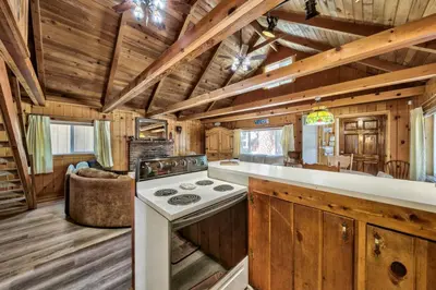 a kitchen with a stove top oven in a cabin at Hank Monk Chalet 2730HM in South Lake Tahoe