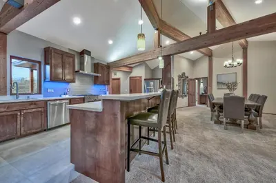 a kitchen with a bar and a dining room at 1044C Coyote Ridge in South Lake Tahoe
