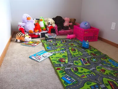 a toy train rug with stuffed animals and toys on the floor at 1044C Coyote Ridge in South Lake Tahoe