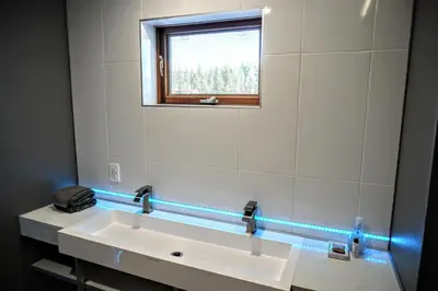a bathroom with a white sink and a window at 1044C Coyote Ridge in South Lake Tahoe