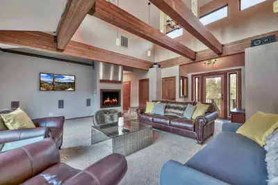 a living room with leather furniture and a fireplace at 1044C Coyote Ridge in South Lake Tahoe