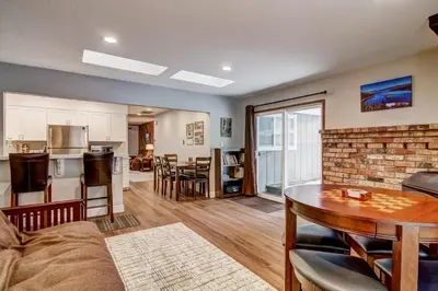 a living room with a couch and a table at 2574C Bear Creek Cabin in South Lake Tahoe
