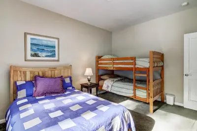 a bedroom with a bed and a bunk bed at 1144GB The Golden Bear Retreat in South Lake Tahoe