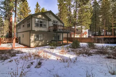 a house in the woods in the snow at 1144GB The Golden Bear Retreat in South Lake Tahoe