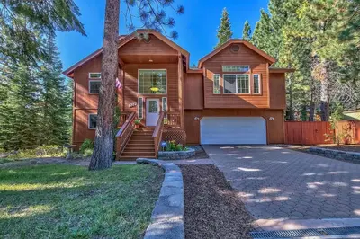a wooden house with a driveway at 122G Where Eagles Fly in South Lake Tahoe