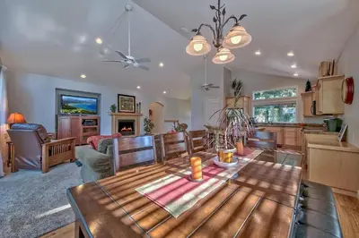 a kitchen and living room with a wooden table at 122G Where Eagles Fly in South Lake Tahoe