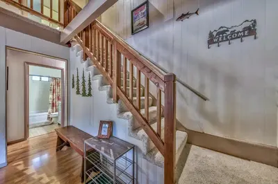 a staircase in a home with a wooden railing at 1625A Atroari Chalet in South Lake Tahoe