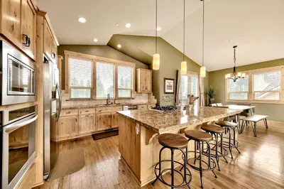 a kitchen with a large island with bar stools at 1376MD Angora View in South Lake Tahoe