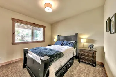 a bedroom with a large bed and a window at 1376MD Angora View in South Lake Tahoe